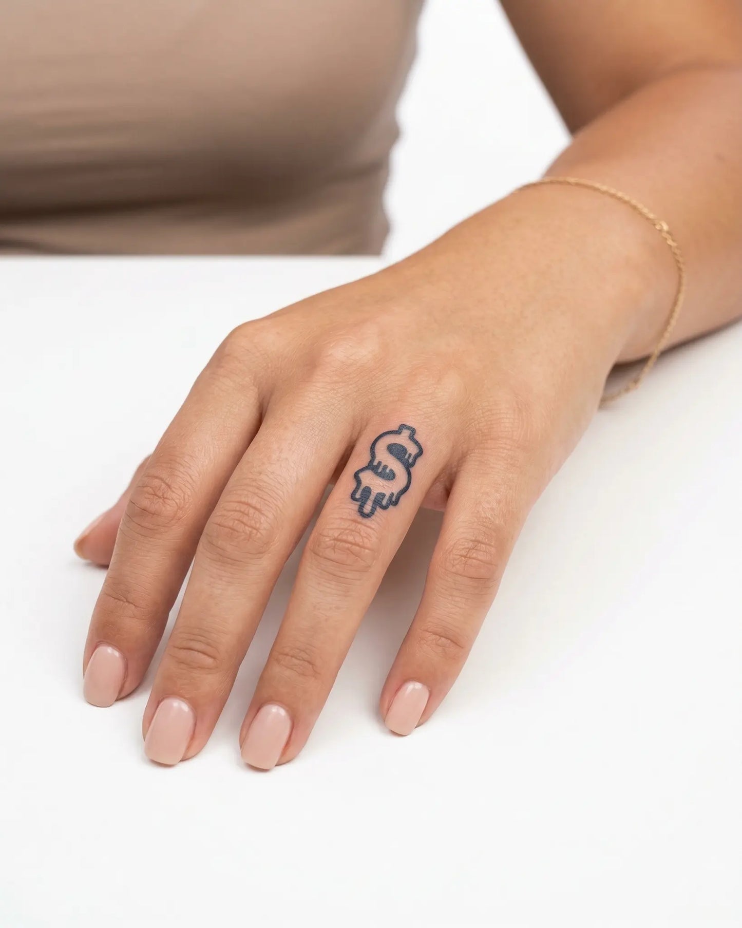 INKY Drip Money semi-permanent tattoo applied on a woman – 0.5 x 0.5 in (1x1 cm) design, realistic ink look, lasts 10 days