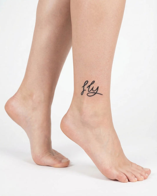 INKY Fly Script semi-permanent tattoo applied on a woman – 2 x 2 in (4x4 cm) design, realistic ink look, lasts 10 days