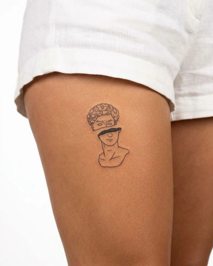 INKY Split Statue semi-permanent tattoo applied on a woman – 3 x 4 in (7x10 cm) design, realistic ink look, lasts 10 days