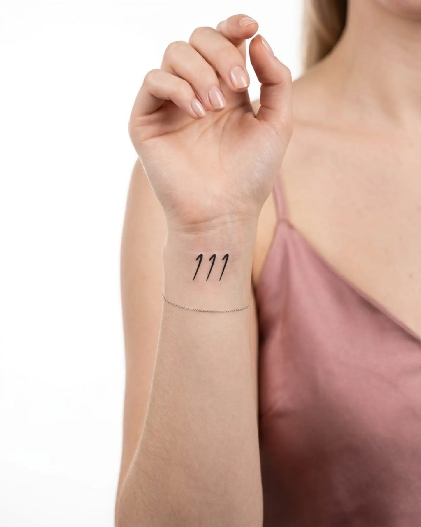 INKY Angel 111 semi-permanent tattoo applied on a woman – 2 x 2 in (4x4 cm) design, realistic ink look, lasts 10 days