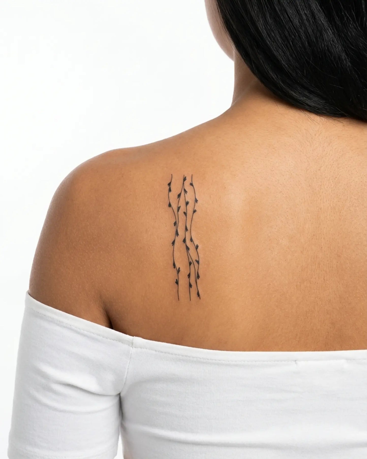 INKY Heart Vines semi-permanent tattoo applied on a woman – 2 x 4 in (6x10 cm) design, realistic ink look, lasts 10 days