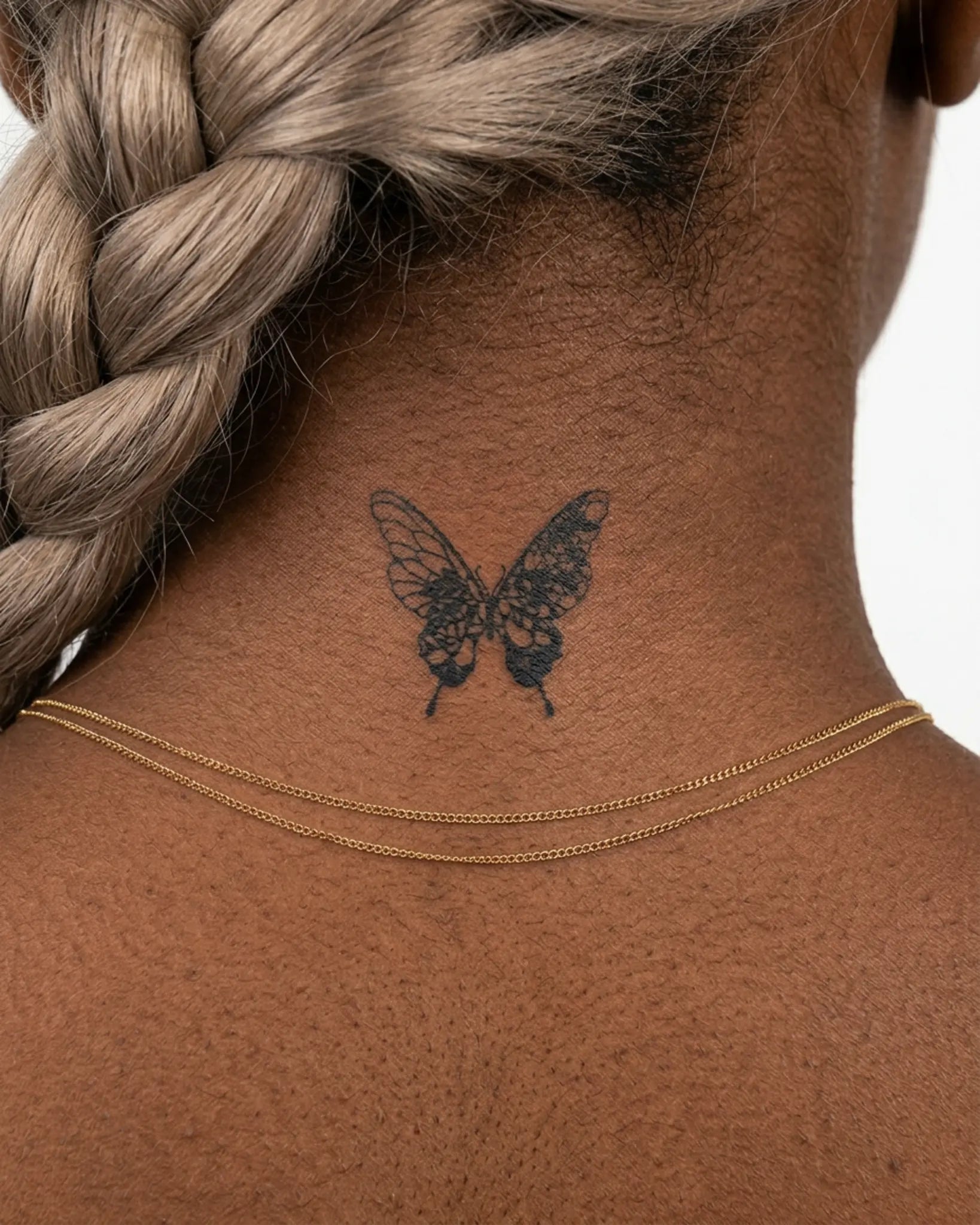 INKY Lace Butterfl semi-permanent tattoo applied on a woman – 2 x 2 in (4x4 cm) design, realistic ink look, lasts 10 days