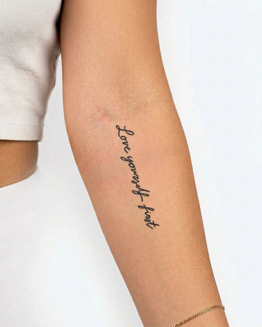 INKY Love First 2 semi-permanent tattoo applied on a woman – 2 x 4 in (6x10 cm) design, realistic ink look, lasts 10 days