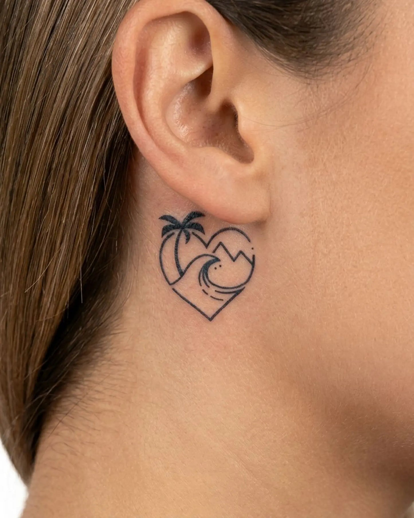 INKY Wanderlust 2 semi-permanent tattoo applied on a woman – 0.5 x 0.5 in (1x1 cm) design, realistic ink look, lasts 10 days