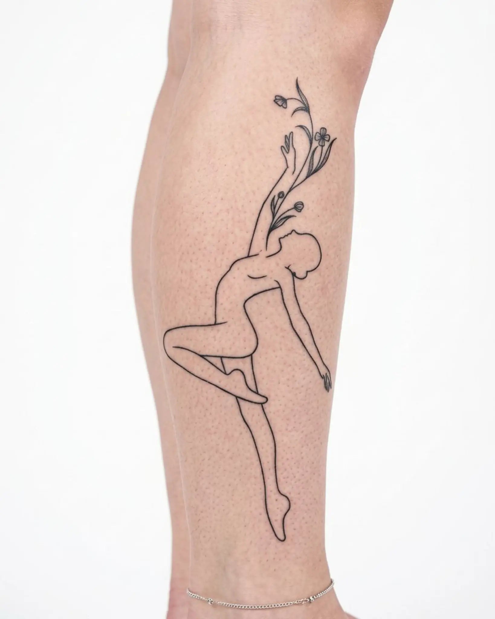 INKY Growth Dancer 2 semi-permanent tattoo applied on a woman – 4 x 7 in (10x17 cm) design, realistic ink look, lasts 10 days