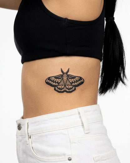 INKY Moon Moth semi-permanent tattoo applied on a woman – 3 x 4 in (7x10 cm) design, realistic ink look, lasts 10 days