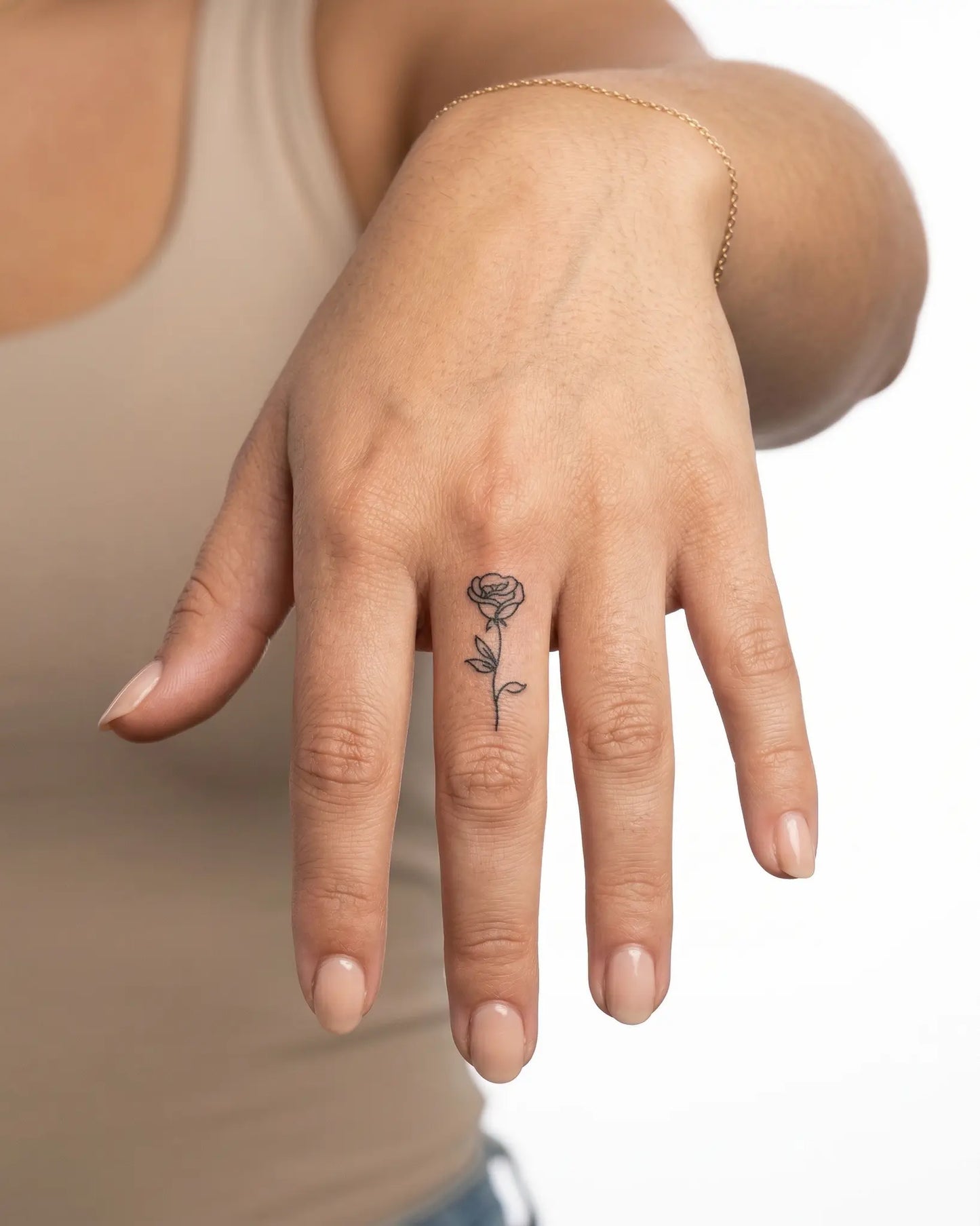 INKY Rose Bloom semi-permanent tattoo applied on a woman – 0.5 x 0.5 in (1x1 cm) design, realistic ink look, lasts 10 days