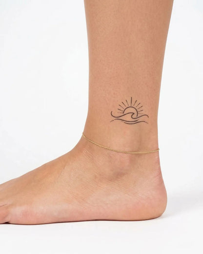 INKY Horizon Sun semi-permanent tattoo applied on a woman – 2 x 2 in (4x4 cm) design, realistic ink look, lasts 10 days