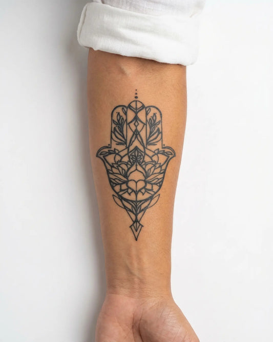 INKY Lotus Hamsa semi-permanent tattoo applied on a woman – 3 x 4 in (7x10 cm) design, realistic ink look, lasts 10 days