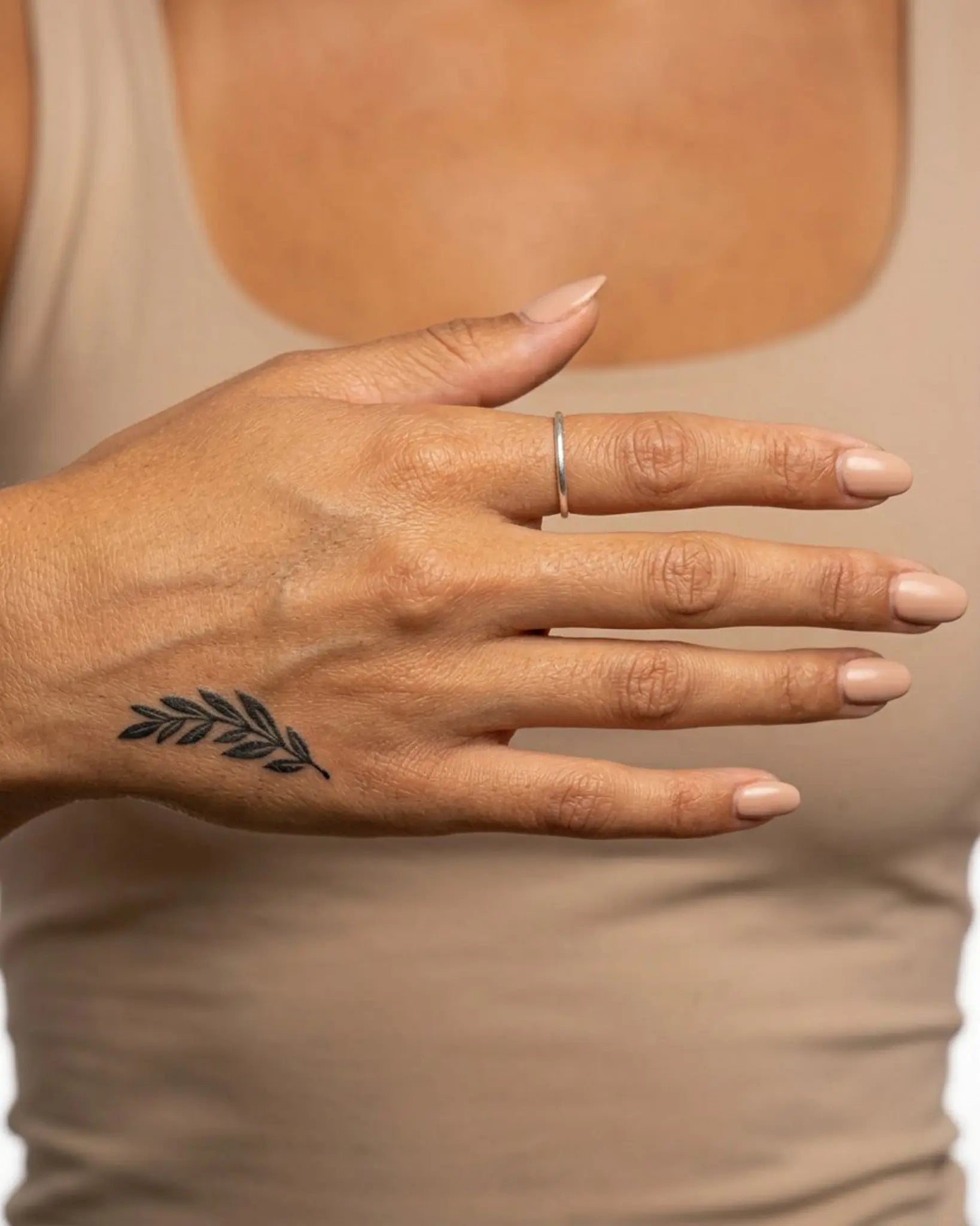 INKY Leafy Branch semi-permanent tattoo applied on a woman – 2 x 2 in (4x4 cm) design, realistic ink look, lasts 10 days