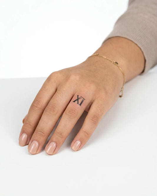 INKY XI Dotwork semi-permanent tattoo applied on a woman – 0.5 x 0.5 in (1x1 cm) design, realistic ink look, lasts 10 days