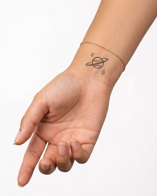 INKY Space Vibes semi-permanent tattoo applied on a woman – 2 x 2 in (4x4 cm) design, realistic ink look, lasts 10 days