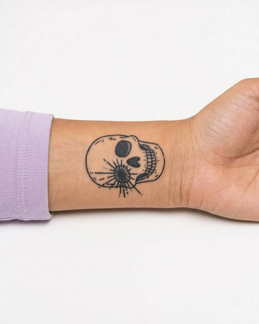 INKY Skull Burst semi-permanent tattoo applied on a woman – 2 x 2 in (4x4 cm) design, realistic ink look, lasts 10 days