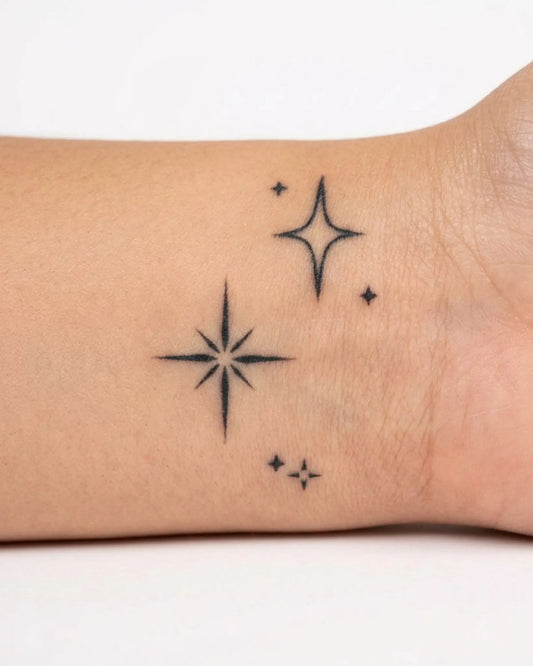 INKY Sparkle Stars semi-permanent tattoo applied on a woman – 2 x 2 in (4x4 cm) design, realistic ink look, lasts 10 days