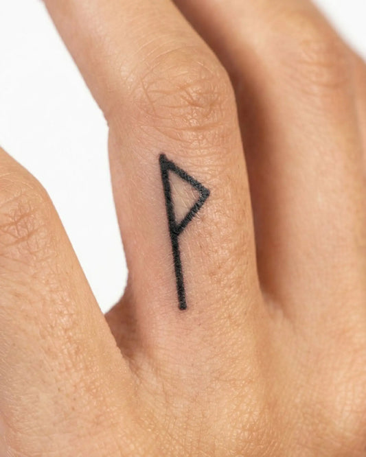 INKY Joy Rune semi-permanent tattoo applied on a woman – 0.5 x 0.5 in (1x1 cm) design, realistic ink look, lasts 10 days