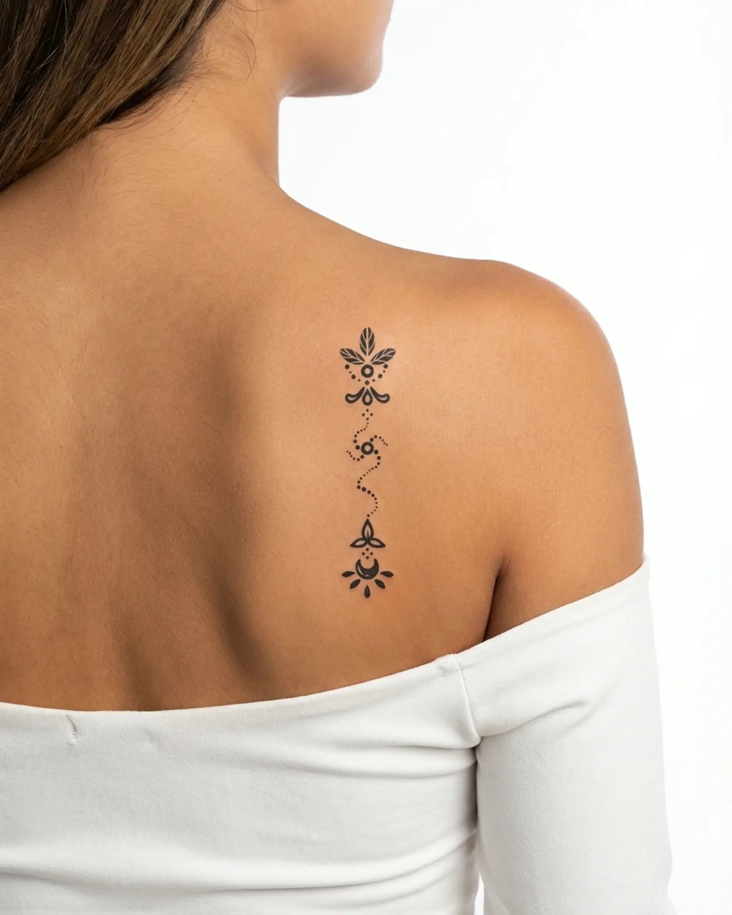 INKY Celestial Pat semi-permanent tattoo applied on a woman – 2 x 4 in (6x10 cm) design, realistic ink look, lasts 10 days