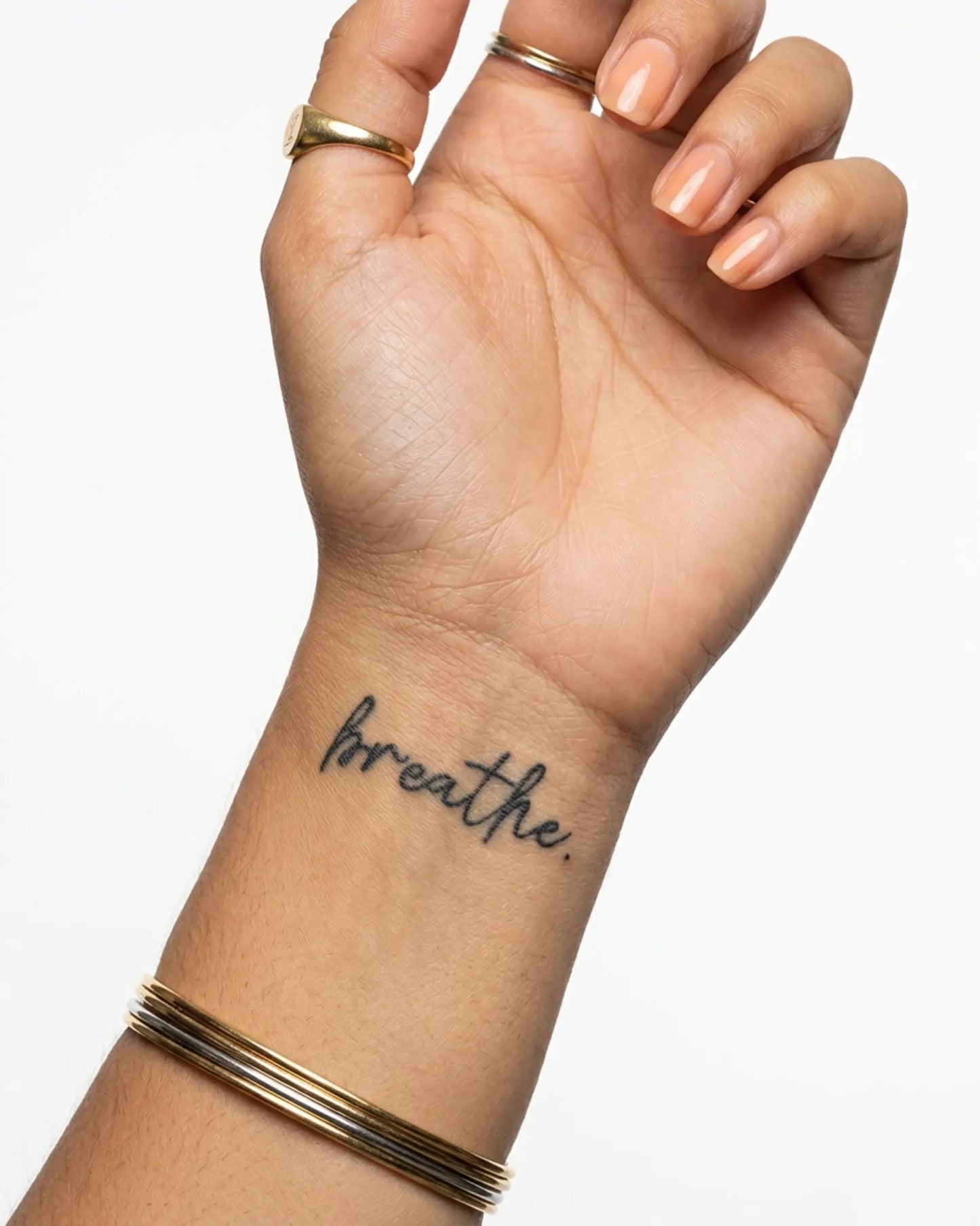 INKY Breathe semi-permanent tattoo applied on a woman – 2 x 2 in (4x4 cm) design, realistic ink look, lasts 10 days