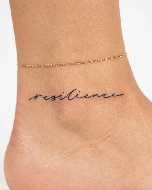 INKY Resilience semi-permanent tattoo applied on a woman – 2 x 2 in (4x4 cm) design, realistic ink look, lasts 10 days