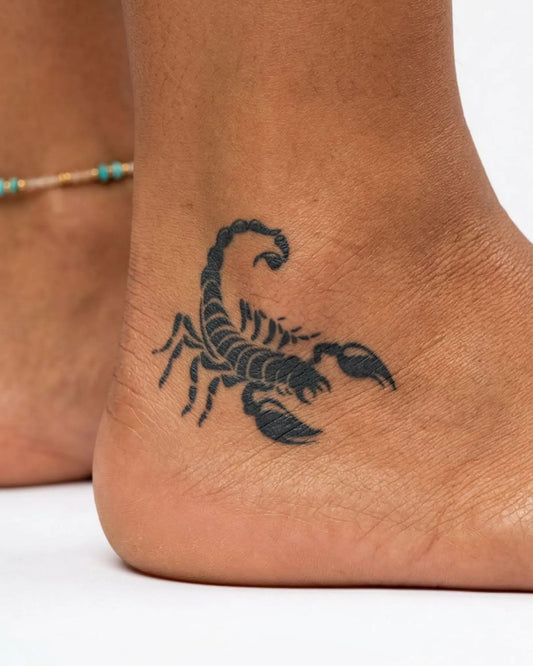 INKY Bold Scorpion semi-permanent tattoo applied on a woman – 2 x 2 in (4x4 cm) design, realistic ink look, lasts 10 days