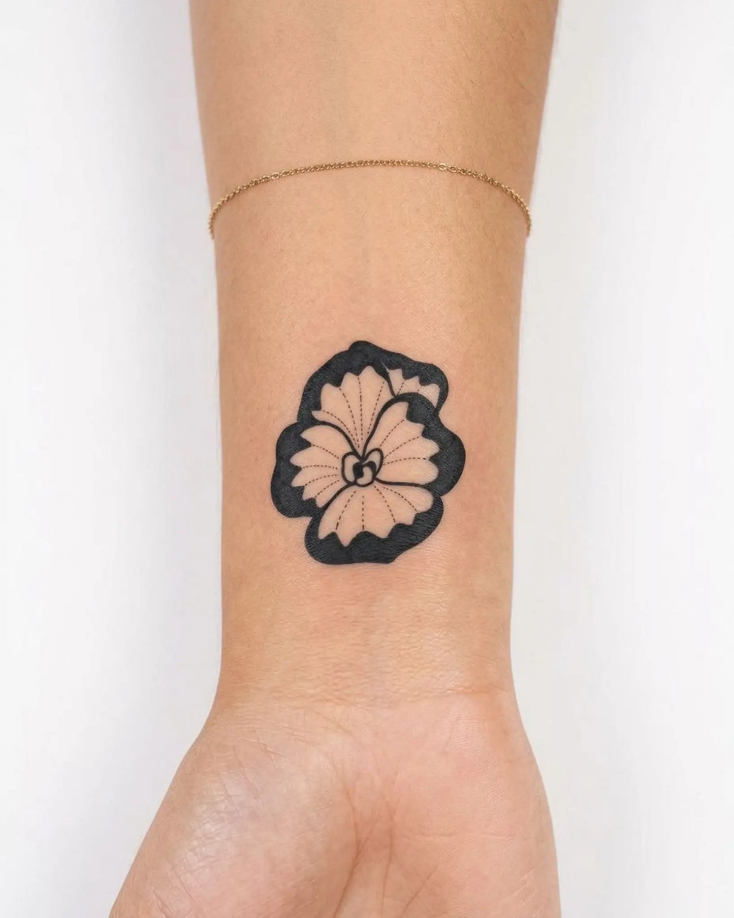 INKY Bold Bloom 2 semi-permanent tattoo applied on a woman – 2 x 2 in (4x4 cm) design, realistic ink look, lasts 10 days