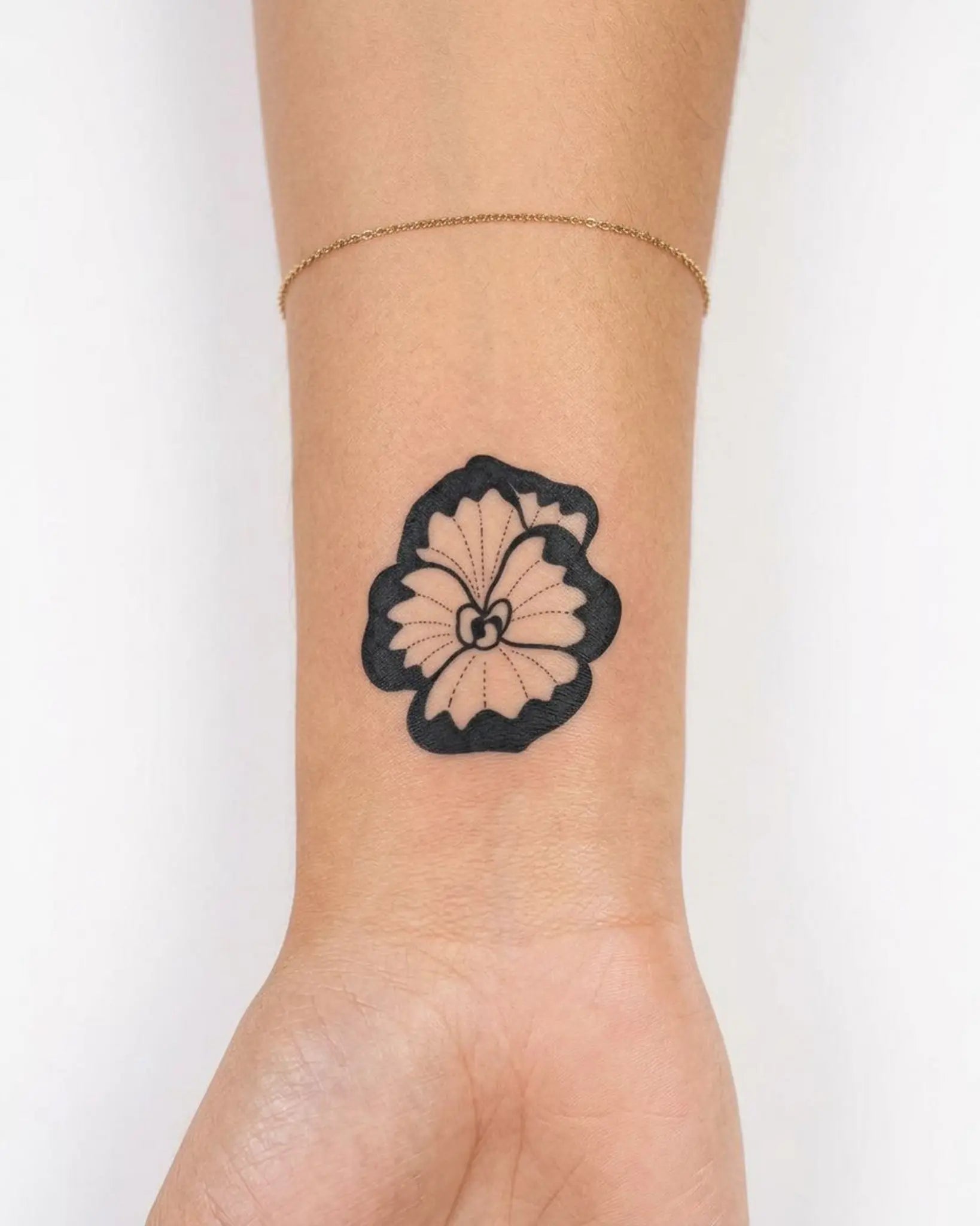 INKY Bold Bloom 2 semi-permanent tattoo applied on a woman – 2 x 2 in (4x4 cm) design, realistic ink look, lasts 10 days
