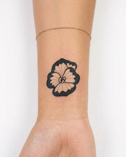 INKY Bold Bloom 2 semi-permanent tattoo applied on a woman – 2 x 2 in (4x4 cm) design, realistic ink look, lasts 10 days