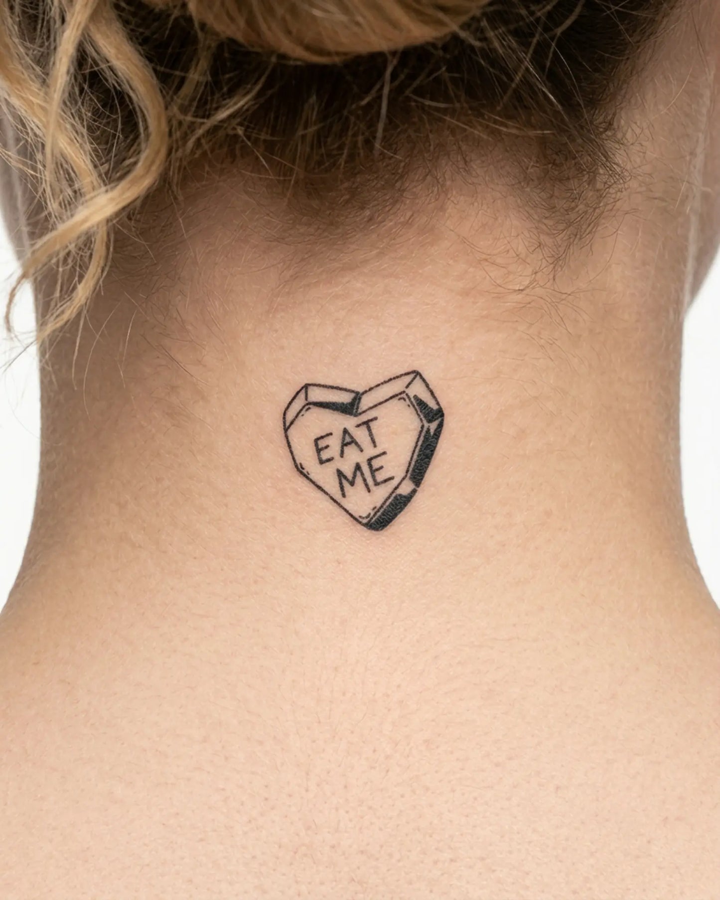 INKY Eat Me Heart semi-permanent tattoo applied on a woman – 2 x 2 in (4x4 cm) design, realistic ink look, lasts 10 days