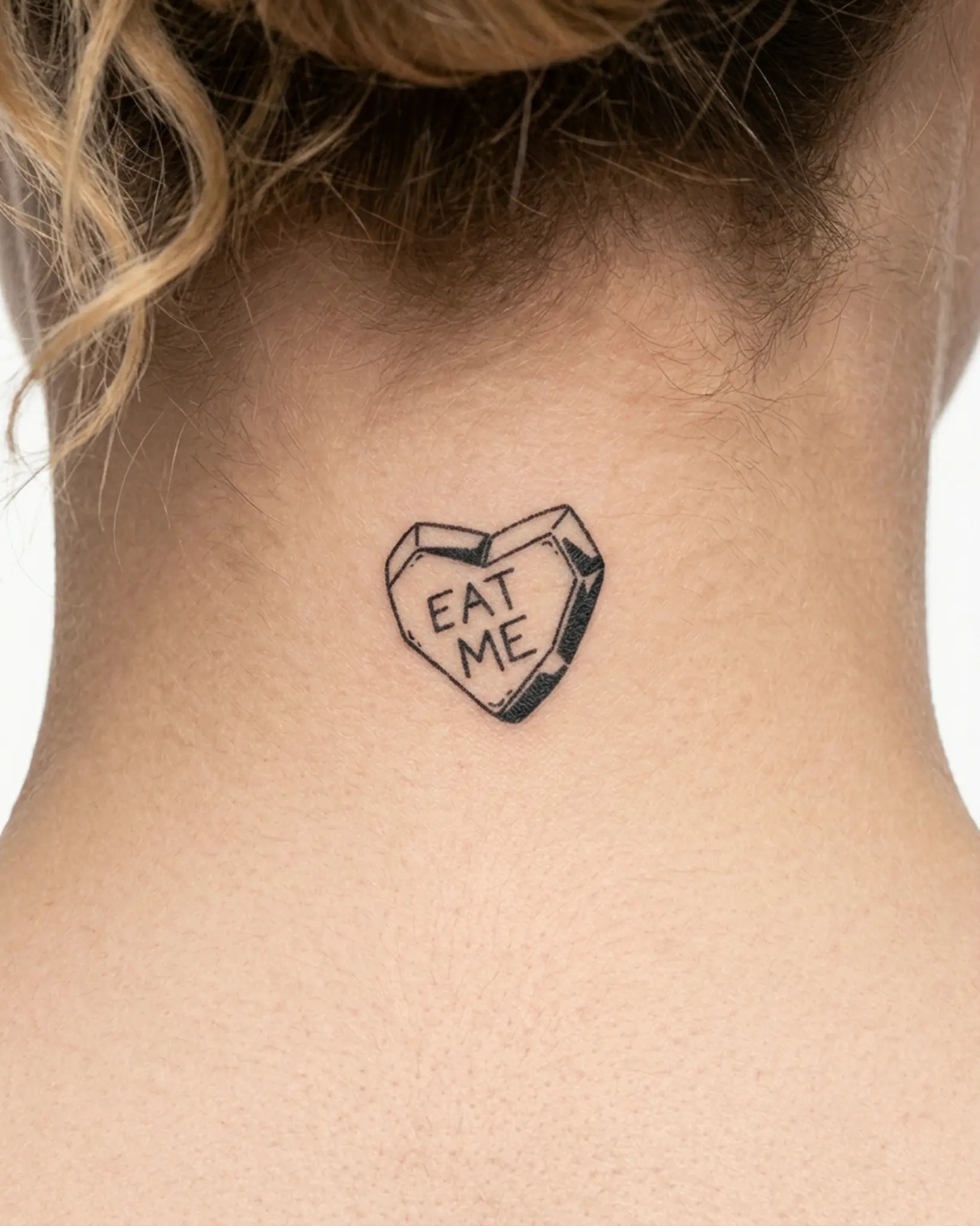 INKY Eat Me Heart semi-permanent tattoo applied on a woman – 2 x 2 in (4x4 cm) design, realistic ink look, lasts 10 days