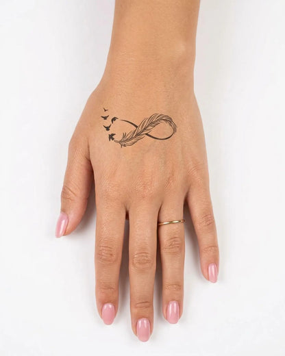 INKY Feather Fligh 2 semi-permanent tattoo applied on a woman – 2 x 2 in (4x4 cm) design, realistic ink look, lasts 10 days