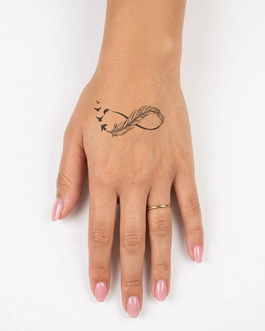 INKY Feather Fligh 2 semi-permanent tattoo applied on a woman – 2 x 2 in (4x4 cm) design, realistic ink look, lasts 10 days