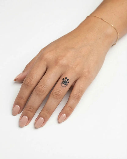 INKY Paw Heart semi-permanent tattoo applied on a woman – 0.5 x 0.5 in (1x1 cm) design, realistic ink look, lasts 10 days