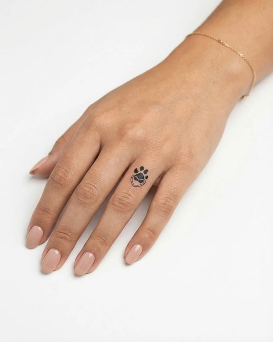 INKY Paw Heart semi-permanent tattoo applied on a woman – 0.5 x 0.5 in (1x1 cm) design, realistic ink look, lasts 10 days