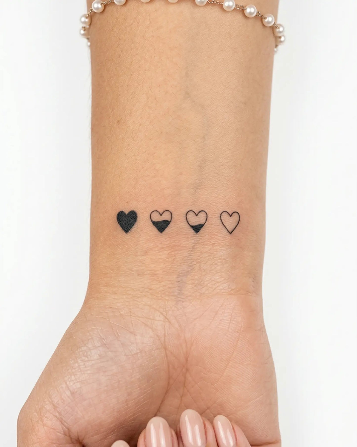 INKY Love Meter 2 semi-permanent tattoo applied on a woman – 2 x 2 in (4x4 cm) design, realistic ink look, lasts 10 days