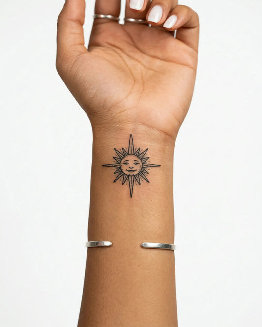 INKY Smiling Sun semi-permanent tattoo applied on a woman – 2 x 2 in (4x4 cm) design, realistic ink look, lasts 10 days