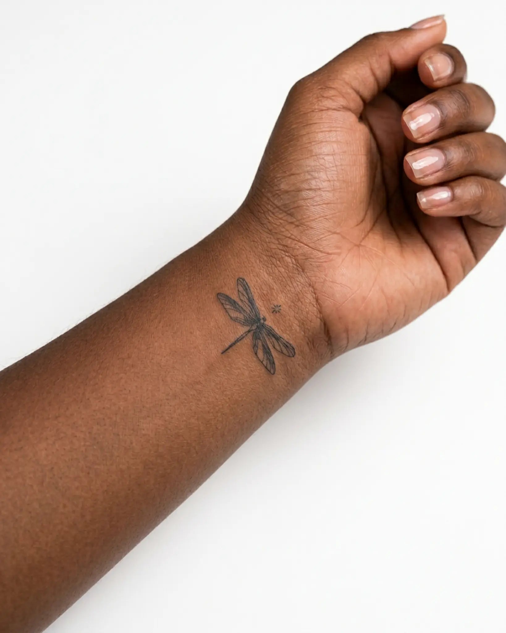 INKY DreamFly semi-permanent tattoo applied on a woman – 2 x 2 in (4x4 cm) design, realistic ink look, lasts 10 days