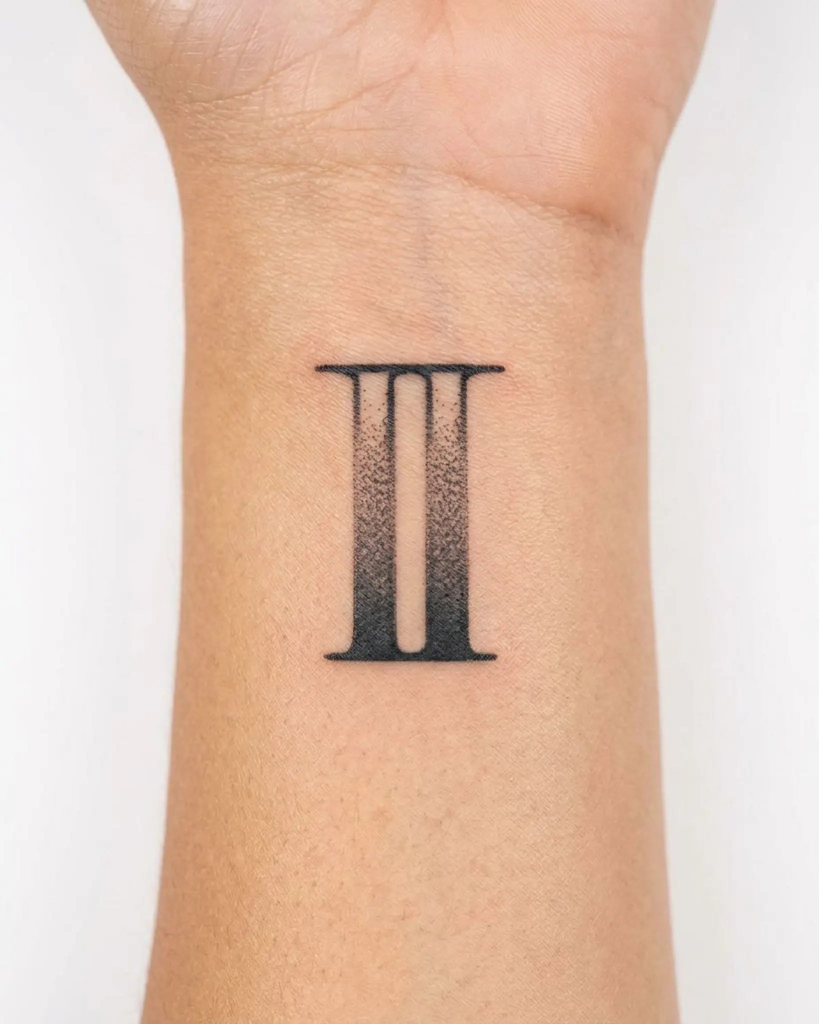 INKY Distressed 2 semi-permanent tattoo applied on a woman – 2 x 2 in (4x4 cm) design, realistic ink look, lasts 10 days