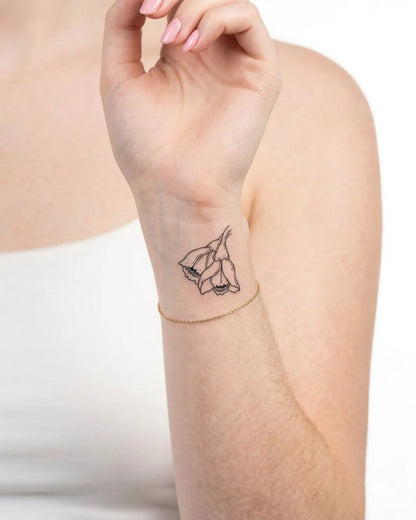 INKY Bellflower semi-permanent tattoo applied on a woman – 2 x 2 in (4x4 cm) design, realistic ink look, lasts 10 days