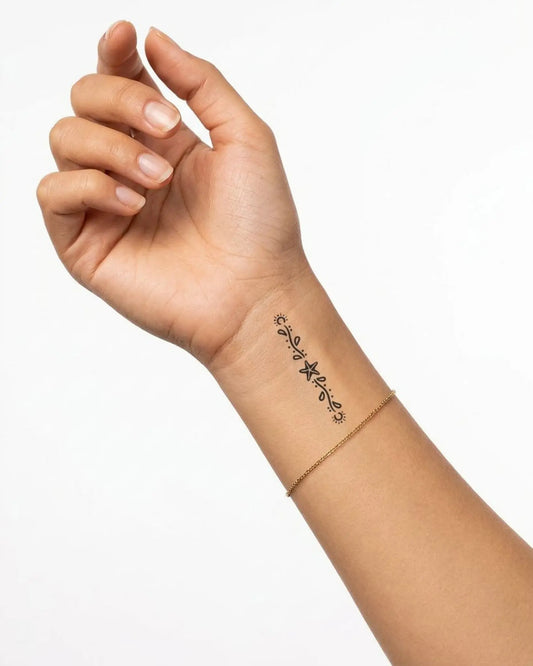 INKY Sun Star Vine semi-permanent tattoo applied on a woman – 2 x 2 in (4x4 cm) design, realistic ink look, lasts 10 days