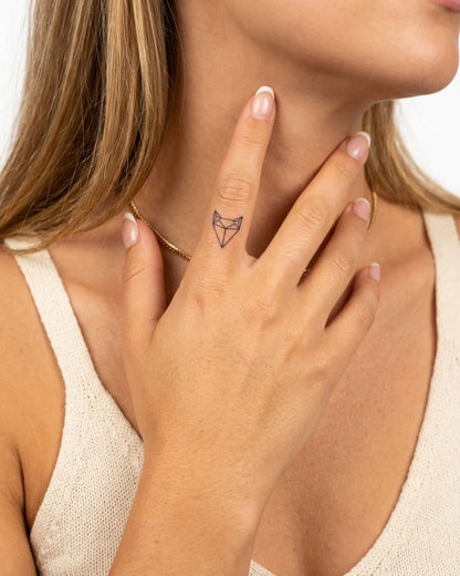 INKY Geo Fox semi-permanent tattoo applied on a woman – 0.5 x 0.5 in (1x1 cm) design, realistic ink look, lasts 10 days