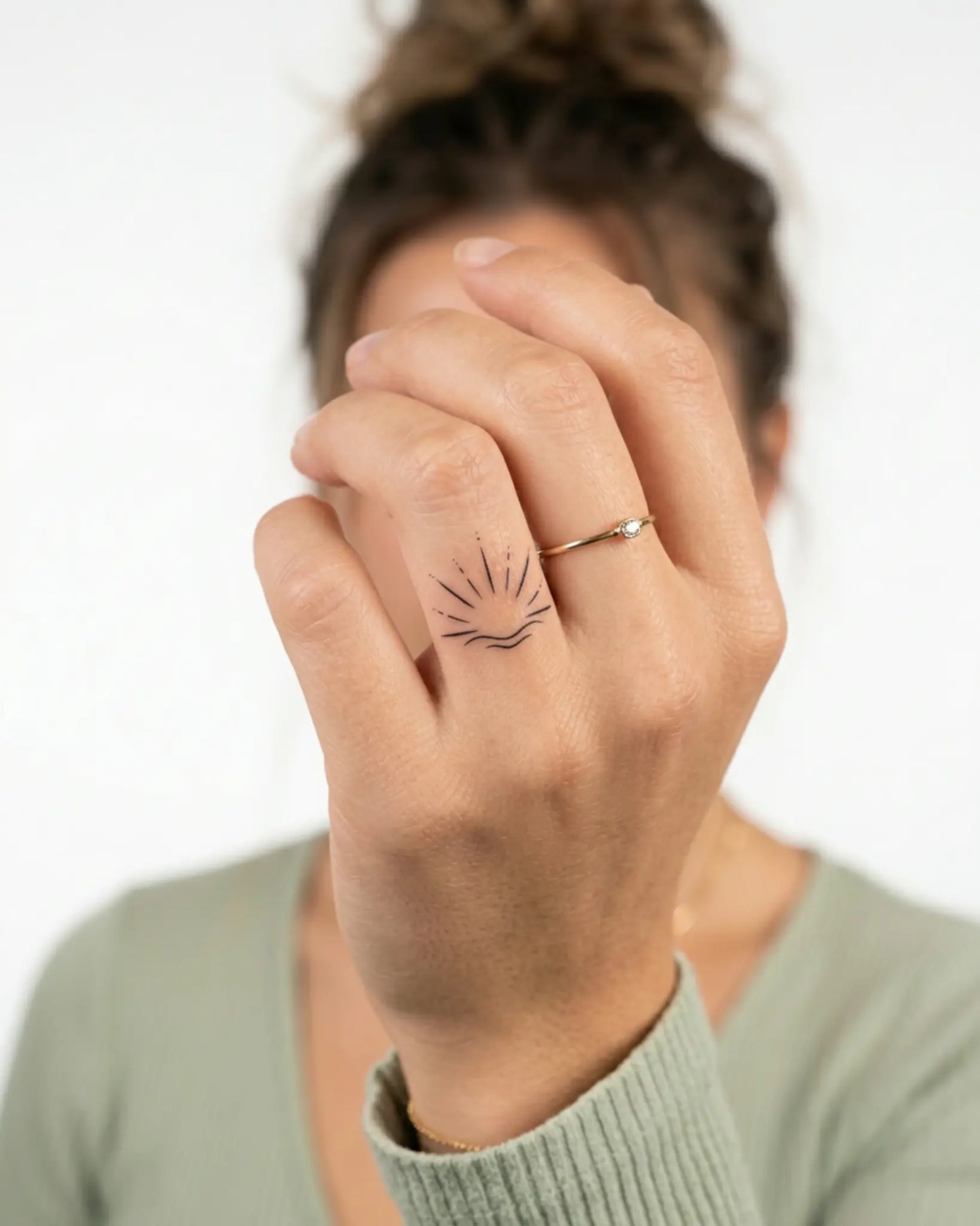 INKY Sunrise Wave semi-permanent tattoo applied on a woman – 0.5 x 0.5 in (1x1 cm) design, realistic ink look, lasts 10 days