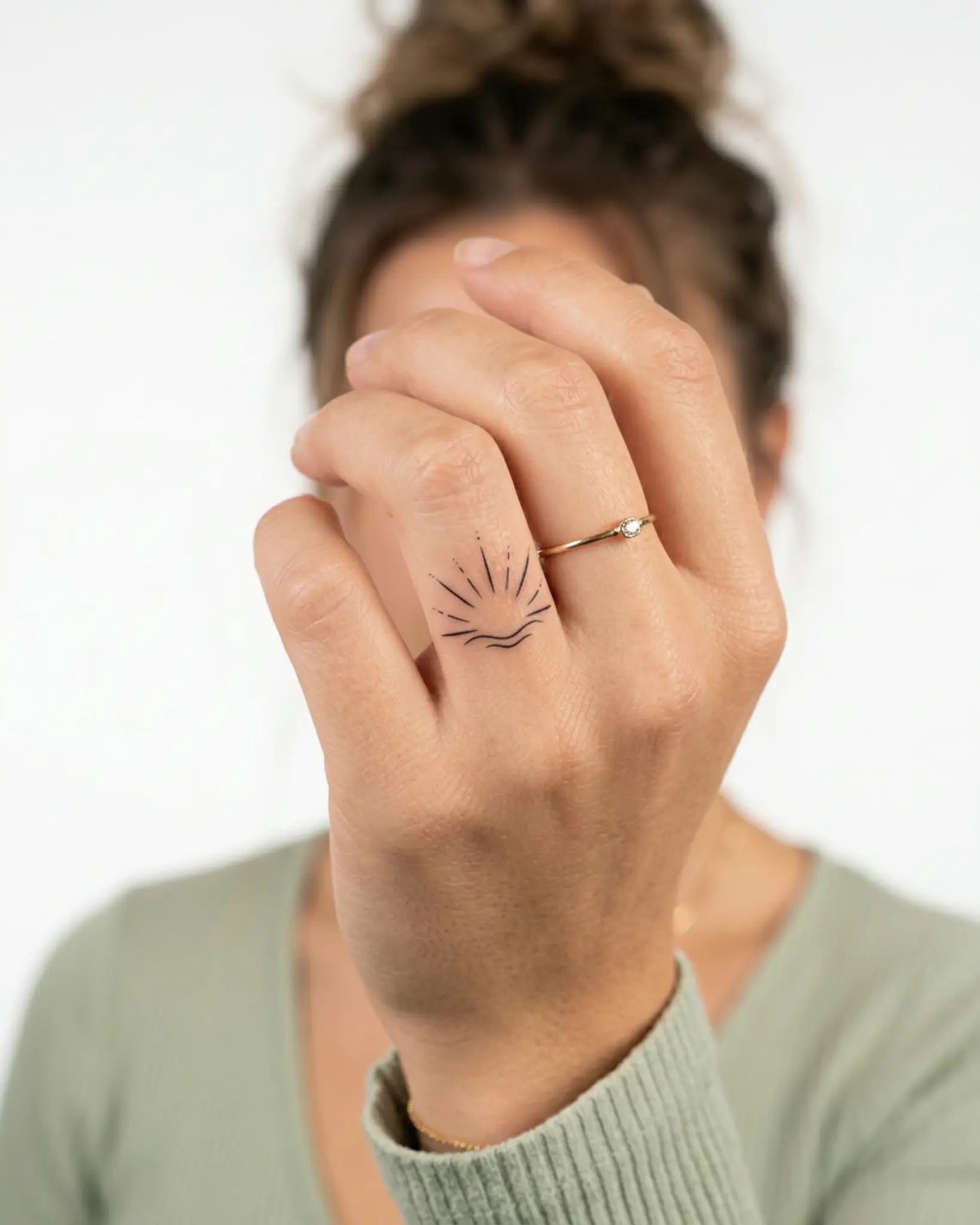 INKY Sunrise Wave semi-permanent tattoo applied on a woman – 0.5 x 0.5 in (1x1 cm) design, realistic ink look, lasts 10 days