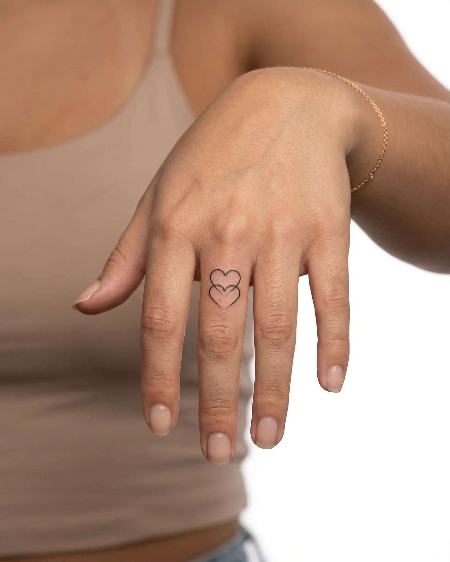 INKY Intertwined semi-permanent tattoo applied on a woman – 0.5 x 0.5 in (1x1 cm) design, realistic ink look, lasts 10 days