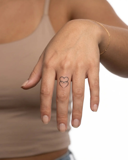 INKY Intertwined semi-permanent tattoo applied on a woman – 0.5 x 0.5 in (1x1 cm) design, realistic ink look, lasts 10 days