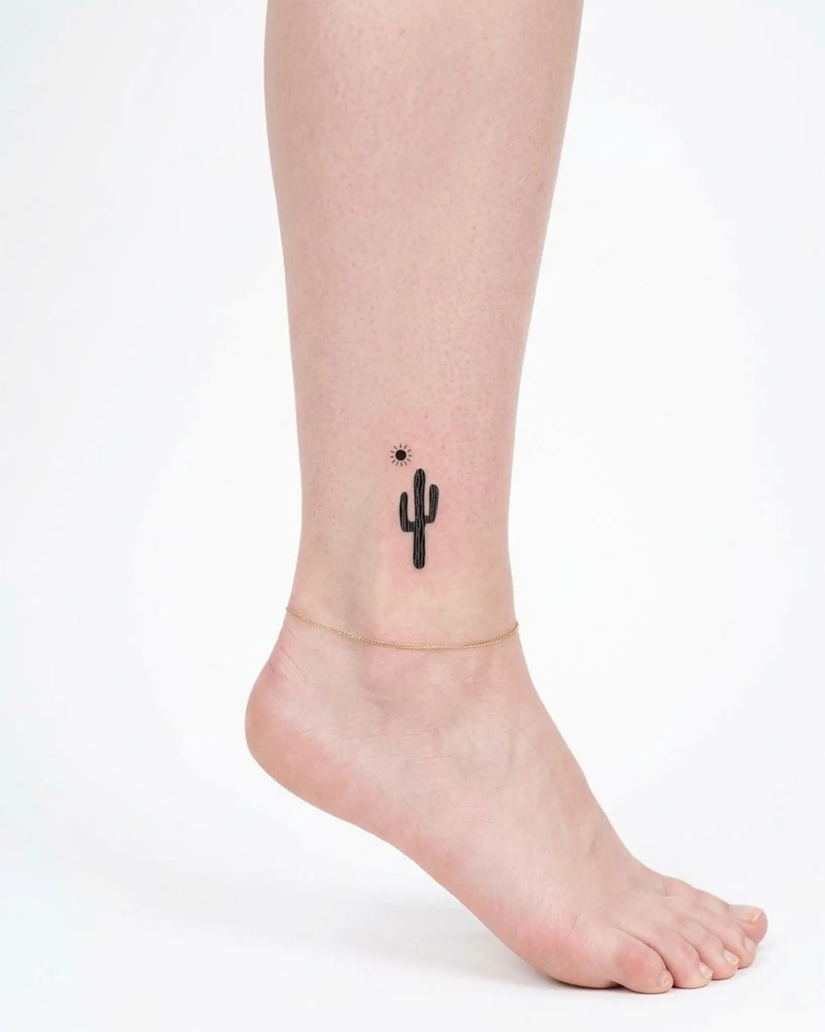 INKY Cactus Sun 2 semi-permanent tattoo applied on a woman – 2 x 2 in (4x4 cm) design, realistic ink look, lasts 10 days