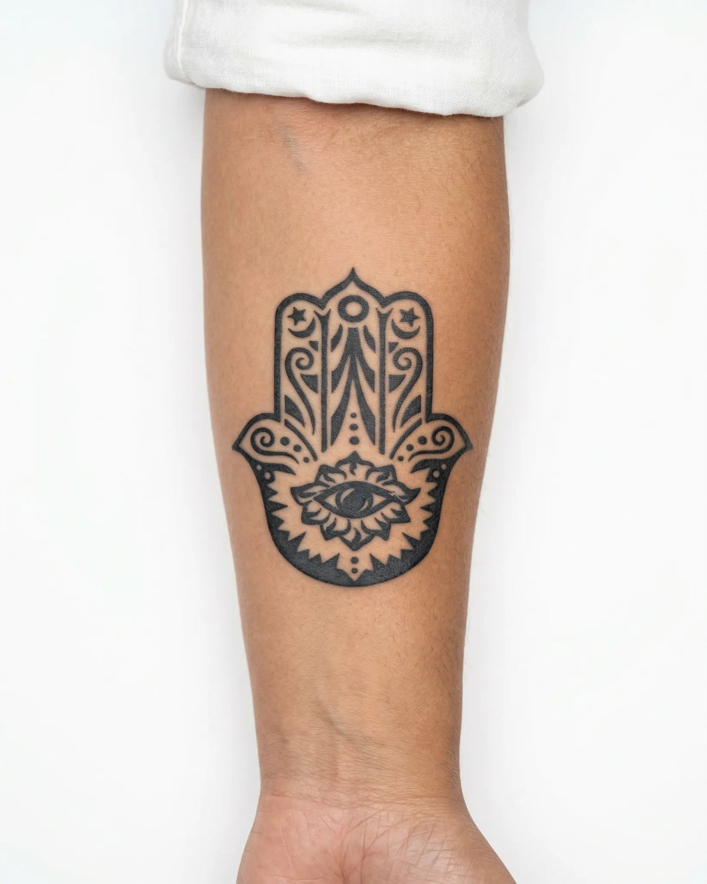 INKY Mystic Hamsa semi-permanent tattoo applied on a woman – 3 x 3 in (7x7 cm) design, realistic ink look, lasts 10 days