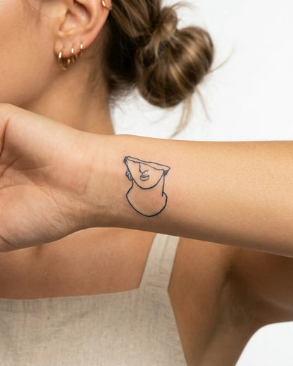 INKY Fragmented 2 semi-permanent tattoo applied on a woman – 2 x 2 in (4x4 cm) design, realistic ink look, lasts 10 days