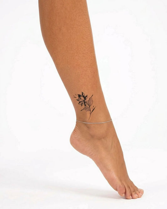 INKY Bloom Noir semi-permanent tattoo applied on a woman – 2 x 2 in (4x4 cm) design, realistic ink look, lasts 10 days