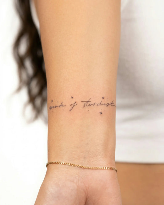 INKY Stardust Scri semi-permanent tattoo applied on a woman – 2 x 2 in (4x4 cm) design, realistic ink look, lasts 10 days