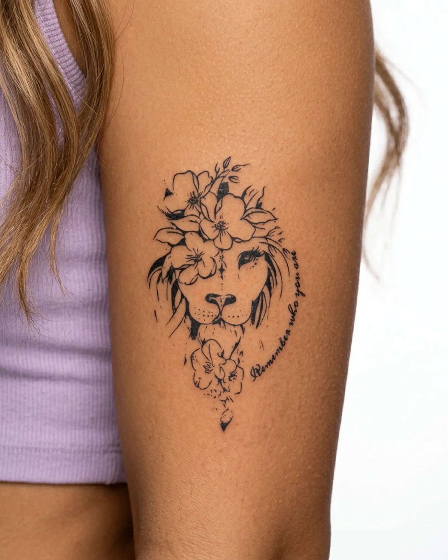 INKY Lion Bloom semi-permanent tattoo applied on a woman – 3 x 4 in (7x10 cm) design, realistic ink look, lasts 10 days