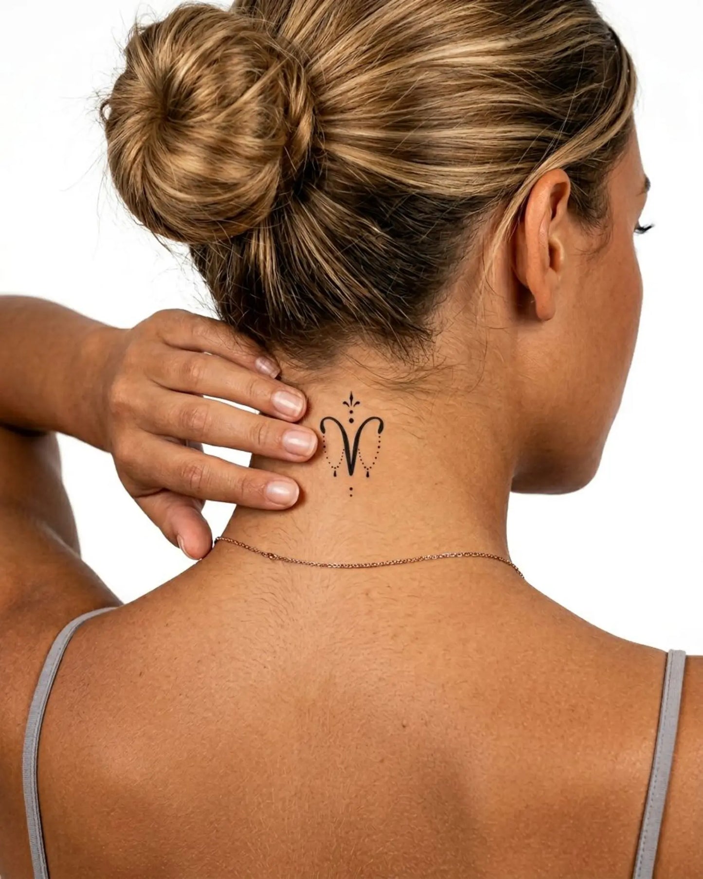 INKY Aries Charm semi-permanent tattoo applied on a woman – 2 x 2 in (4x4 cm) design, realistic ink look, lasts 10 days